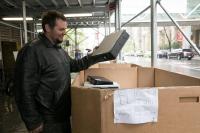 A man throws his unwanted computer hard drive into a secure disposal bin at the annual Shred Fest and Bike-to-Campus Day event at Columbia University Irving Medical Center on April 26, 2019.